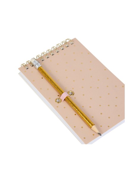Carnet de notes rose à spirales avec crayon doré